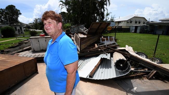 Helen Muller stands in the ruins of her double garage, built by her father, in Proserpine. Picture: AAP