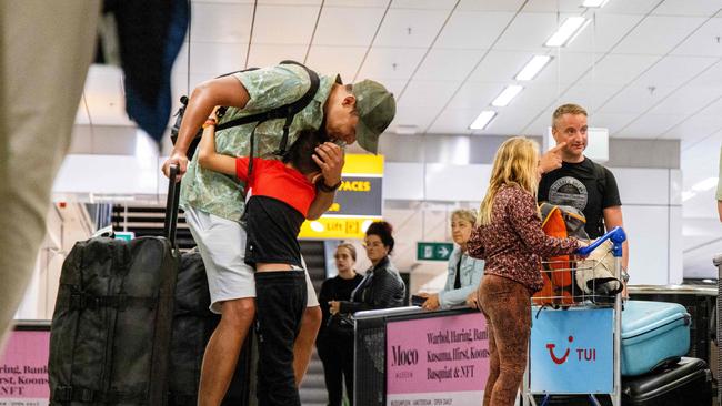 Travelers gesture as they arrive after returning from the Greek island of Rhodes where evacuations are underway due to wildfires. Picture: AFP