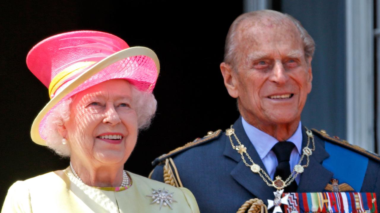 Queen Elizabeth II and Prince Philip, Duke of Edinburgh watch a fly-past of Spitfire and Hurricane aircraft from the balcony of Buckingham Palace in 2015. Picture: Getty Images