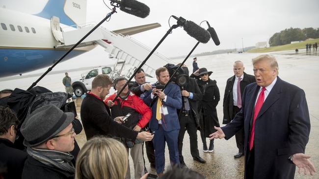 President Donald Trump speaks to reporters about the shooting at a Pittsburgh synagogue as he arrives at Air Force One at Andrews Air Force Base.