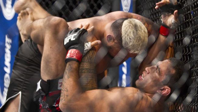 Mark Hunt gets on top of Fabricio Werdum from during a UFC 180 interim Heavyweight title fight.