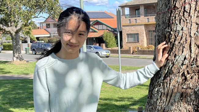 Sofianna Han, 14, pictured next to the tree housing the cockatoos in Five Dock Park. Picture: Alexi Demetriadi