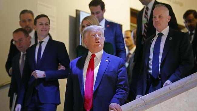 US President Donald Trump, Jared Kushner (left) and Ivanka Trump, behind the President, leave the World Economic Forum in Davos, Switzerland. Picture: AP