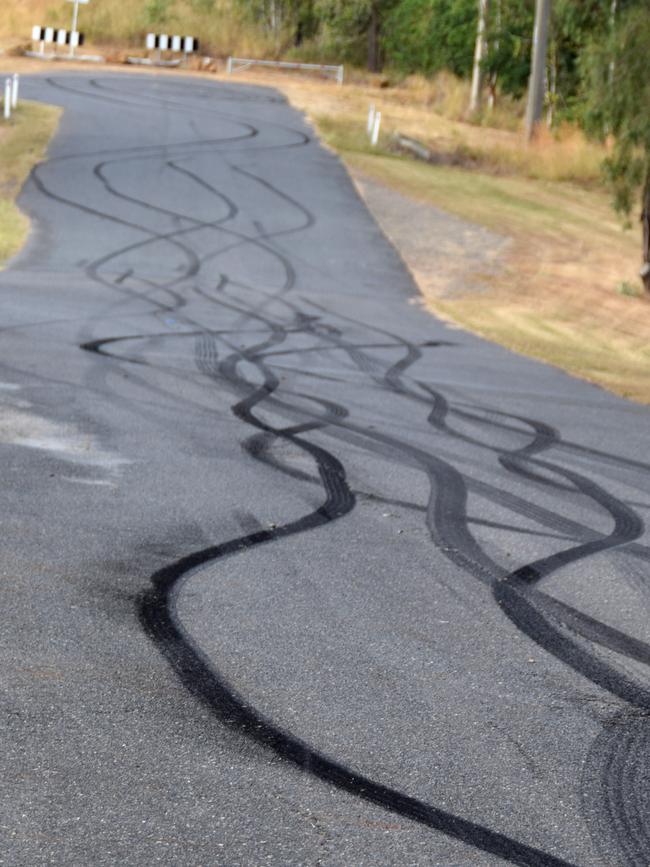 The condition of the road outside Rockhampton Memorial Gardens following mourners' burn outs