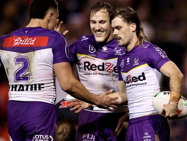 PENRITH, AUSTRALIA - AUGUST 15: Ryan Papenhuyzen of the Storm celebrates with team mates at full-time during the round 24 NRL match between Penrith Panthers and Melbourne Storm at BlueBet Stadium, on August 15, 2024, in Penrith, Australia. (Photo by Brendon Thorne/Getty Images)