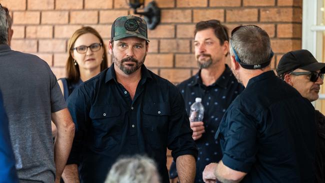 Linford Feick's son Ben was comforted by loved ones following the funeral for his father and Nightcliff Friendly Grocer owner on Wednesday, May 7 at Resthaven Chapel. Picture: Pema Tamang Pakhrin