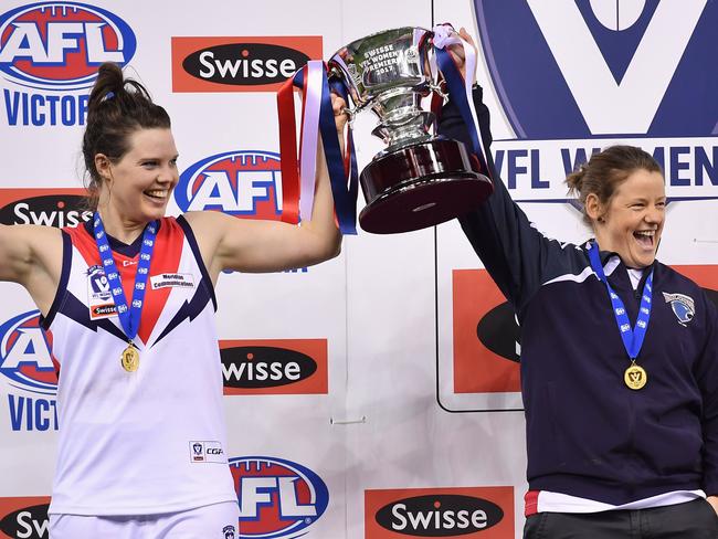 Darebin Falcons captain Elise O'Dea and coach Jane Lange celebrate with the trophy after defeating Diamond Creek during the VFL Women's Grand Final at Etihad Stadium in Docklands, Sunday, Sept. 24, 2017. (Picture/Andy Brownbill