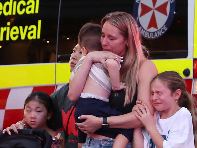 A family leaves the shopping mall after the stabbing incident on April 13, 2024. It’s hard to imagine how you would react in such an emergency. Picture: David Gray/AFP