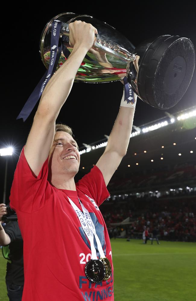 Adelaide United hero Craig Goodwin with the FFA trophy. Picture: Sarah Reed