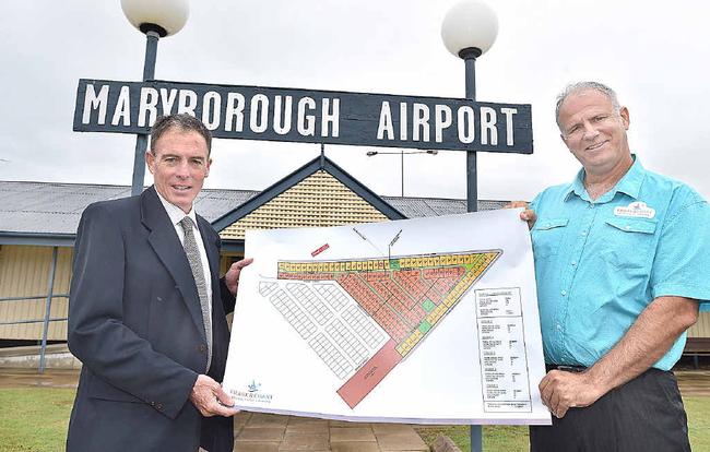 BIG PLANS: Fraser Coast Residential Airpark Pty Ltd director Brad Tallis (right) with Mayor Gerard O’Connell and plans for the proposed development. Picture: Alistair Brightman