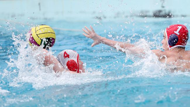 Gosford’s Will Drummond takes on Wyong goalie James Lumby in their under-14 clash at Gosford Pool on Saturday. Picture: Sue Graham