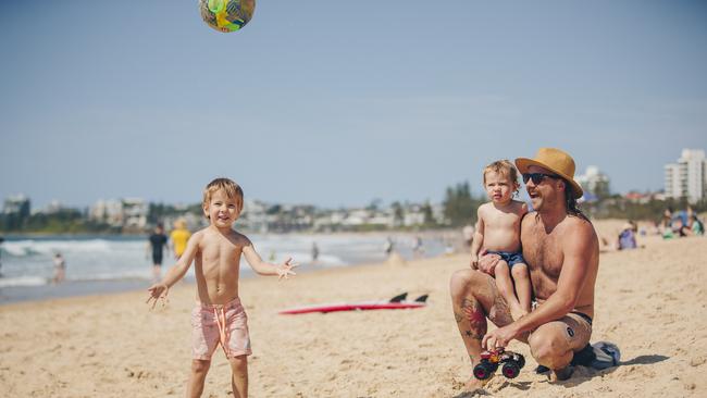 Tynan Curry enjoys a family day at Maroochydore Beach with sons Fergus (2) and Bruce (4). Picture: Ben Vos.