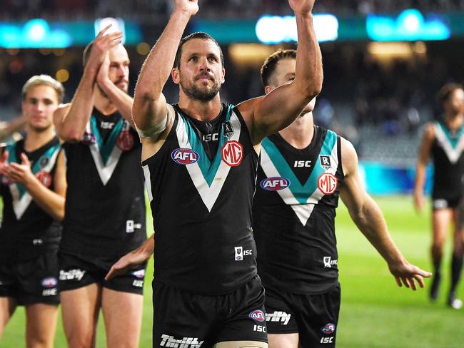 ADELAIDE, AUSTRALIA - AUGUST 08: Travis Boak of Port Adelaide   celebrates the win with the fans during the round 11 AFL match between the Port Adelaide Power and the Richmond Tigers at Adelaide Oval on August 08, 2020 in Adelaide, Australia. (Photo by Mark Brake/Getty Images)