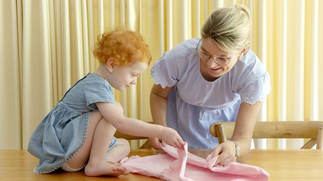 Vanessa Pearson with her three-year-old daughter, Imogen practising the Marie Kondo method. Picture: AAP/Sarah Marshall