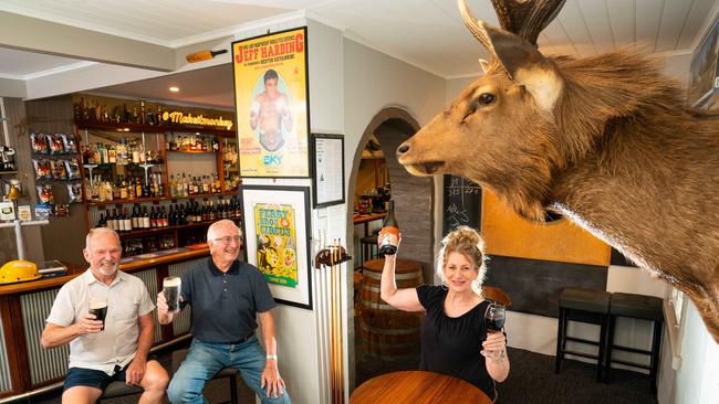 Happy Valley Hotel owner Lynn Waight with locals Roger Cowie and Ian Scott, who enjoy a Guinness every Friday. Picture: Simon Dallinger