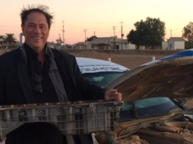 Sump thing is wrong. John Connolly with the ute's busted sump in Marree.