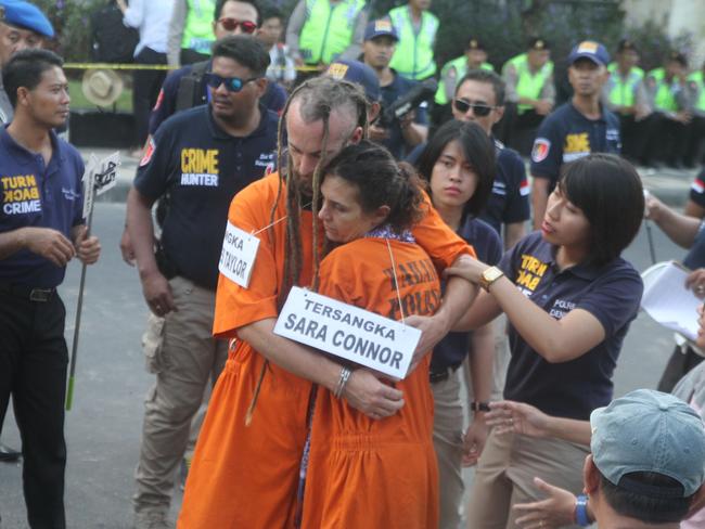 Sara Connor and David Taylor taking part in the police reconstruction on Kuta Beach. Picture: Zul Edoardo.