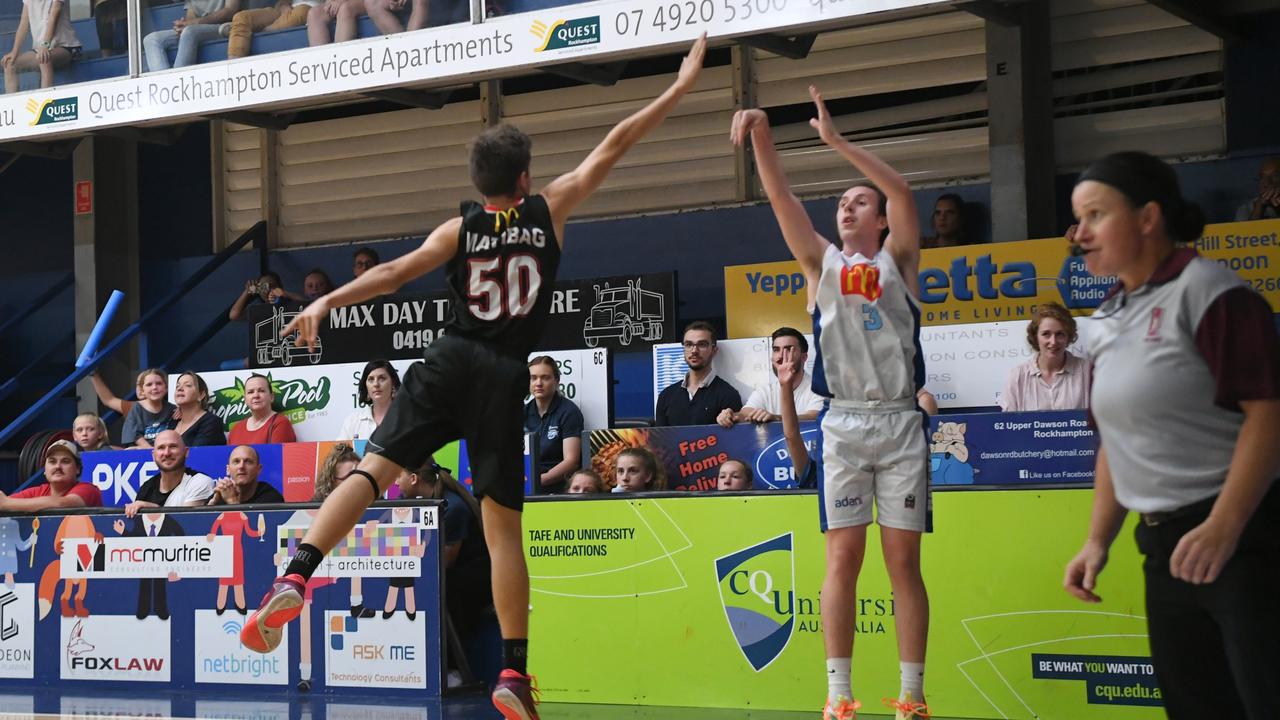 BASKETBALL ConocoPhillips CQ Cup Rd 1: Mackay Meteors' Lachlan Inkson and Rockhampton Rockets' Jaxson Zulian
