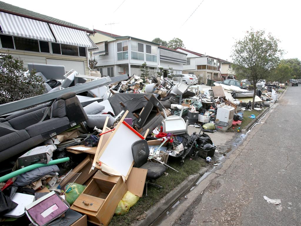 Finishing the clean up after the flood, on Logan Ave Oxley. Photo Steve Pohlner