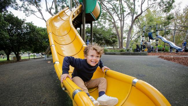 Henry Gow-Gates, 4, starting his Friday with a slide