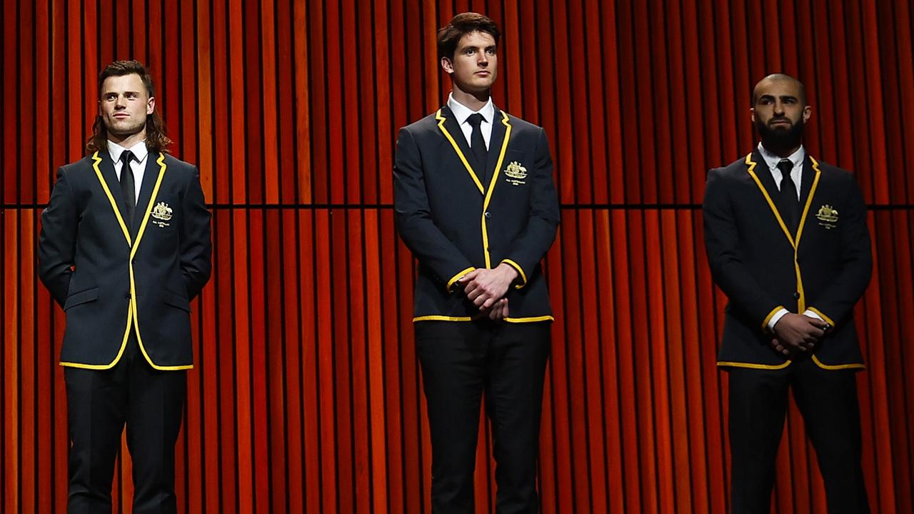 New Giants club champion Sam Taylor (middle) was picked in the All-Australian backline on Wedbndday, alongside the likes if Jack Snclair (left) and Getty Images