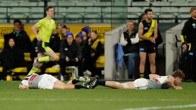 Zak Butters and Tom Jonas hit the deck after clashing heads. Picture: AFL Photos/Getty Images