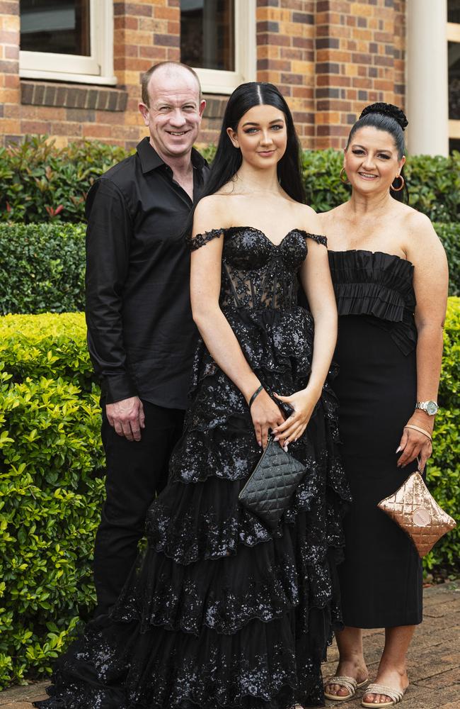 Graduate Obie Costigan with dad Trent and mum Rachel Costigan as Downlands College year 12 students come together for their valedictory mass at the college, Saturday, November 16, 2024. Picture: Kevin Farmer