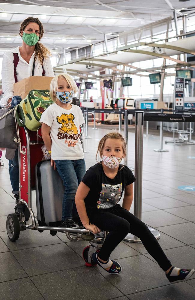 Marina Lunadri with children Sunny, 4, and Sienna, 5, at the check-in desk at Sydney Airport on Saturday. Picture: Flavio Brancaleone/NCA NewsWire