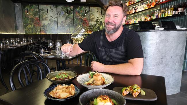 Pokkoi Kitchen, an Asian fusion restaurant, has been opened in Coolangatta by chef and owner Cameron Knox, who is pictured here with some of his dishes. Picture: Glenn Hampson.