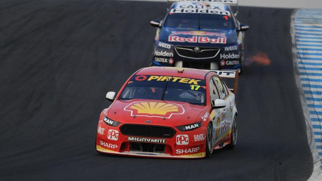 Scott McLaughlin heads Jamie Whincup during Race 9 at Phillip Island. Pic: Mark Horsburgh.