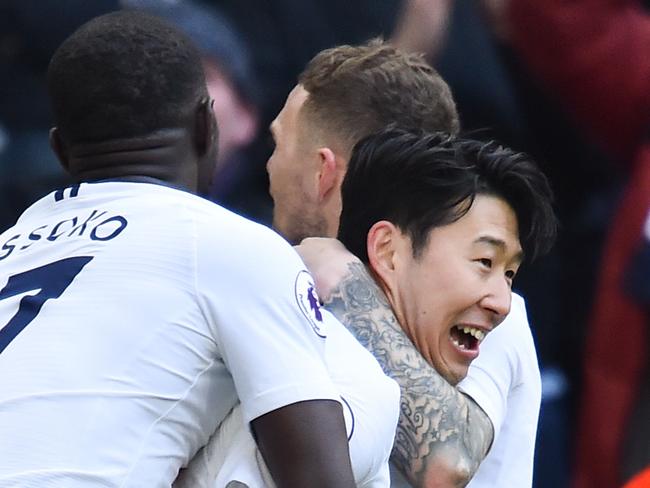 Tottenham Hotspur's South Korean striker Son Heung-Min (C) celebrates scoring the opening goal during the English Premier League football match between Tottenham Hotspur and Newcastle United at Wembley Stadium in London, on February 2, 2019. (Photo by Glyn KIRK / AFP) / RESTRICTED TO EDITORIAL USE. No use with unauthorized audio, video, data, fixture lists, club/league logos or 'live' services. Online in-match use limited to 120 images. An additional 40 images may be used in extra time. No video emulation. Social media in-match use limited to 120 images. An additional 40 images may be used in extra time. No use in betting publications, games or single club/league/player publications. /