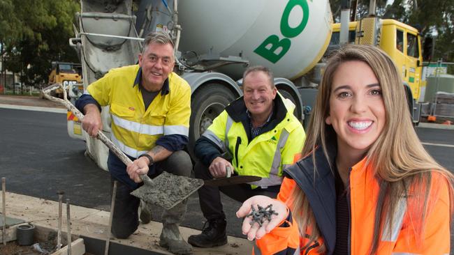 Seels Technology founder Stephen Seeley with Marion Council civil services manager Colin Natt and Seels Technology director Abbey Seeley holding plastic atoms used to make concrete. Picture: Marion Council/Supplied