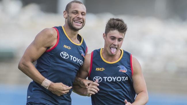 What pressure? Cameron Ellis-Yolmen and Riley Knight bump into each other at training on Thursday. Smith says the Crows are embracing being the hunters again this year.