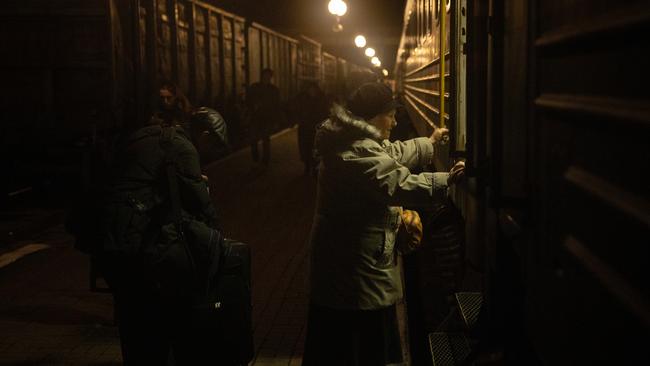 A resident boards an evacuation train in Kherson, Ukraine. Picture: Getty Images.