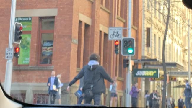 A man is seen brandishing a knife on Clarence Street. Picture: Twitter / @Ayusha77