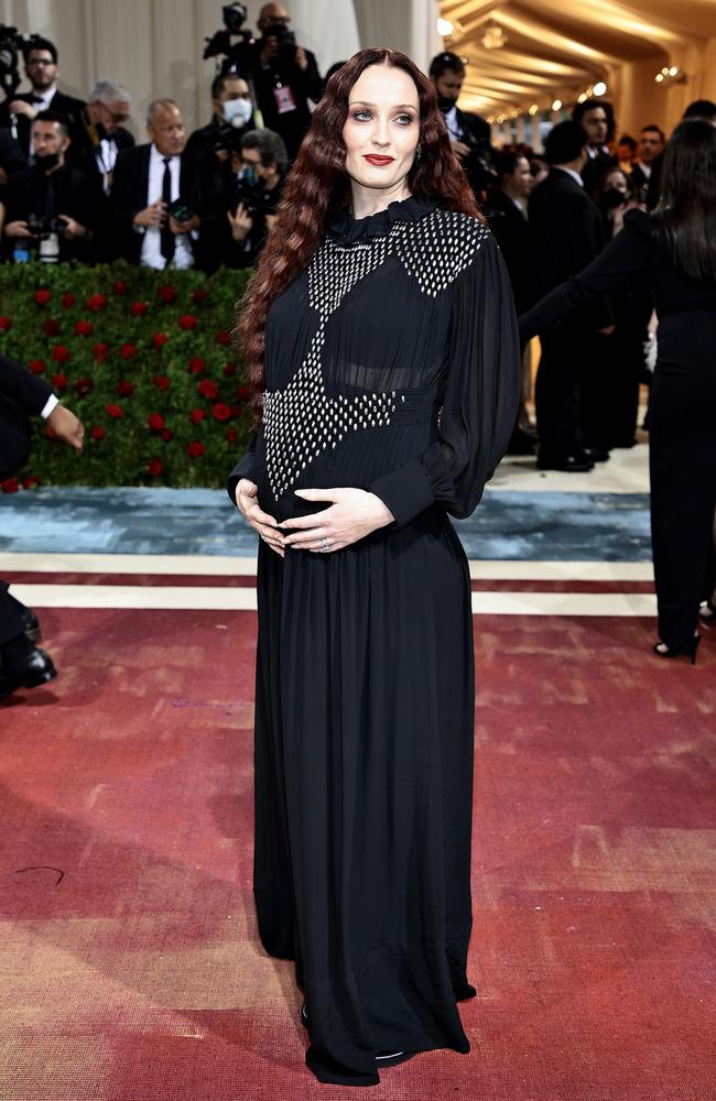 Turner cradled her growing baby bump. Picture: Dimitrios Kambouris/Getty Images for The Met Museum/Vogue