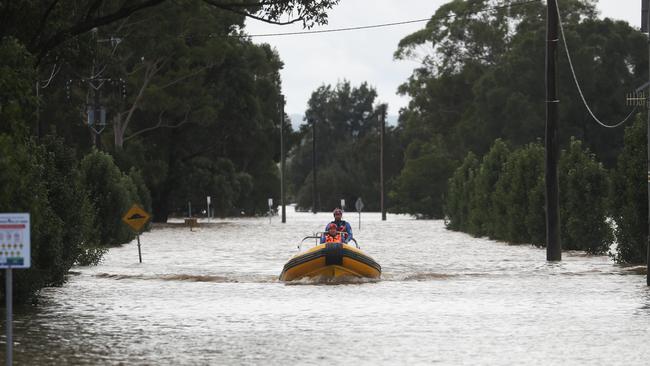 SES Hawkesbury 34 launch a rescue boat from George St, Windsor to deliver needed medical and vet supplies to cut of properties. Picture: John Grainger