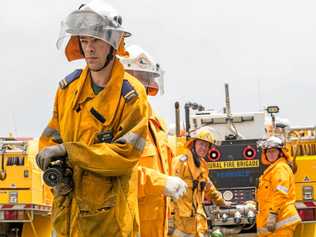 AT THE READY: Fernvale First Officer Andrew Rose prepares to lead the strike team based at Summerholm to combat multiple fires in the Gatton area believed to be lit by an arsonist. Picture: Ali Kuchel