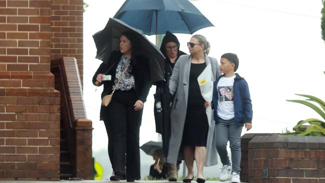 Family and mourners at St Joseph’s Catholic Church on Friday.