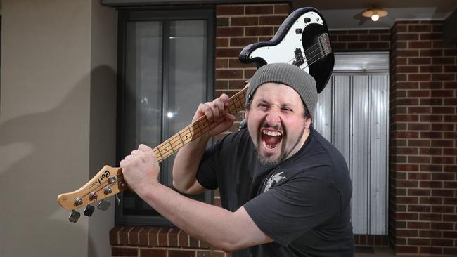 Mike Conomy with the guitar he used to defend himself and partner Annabelle Sutton. Picture: David Crosling