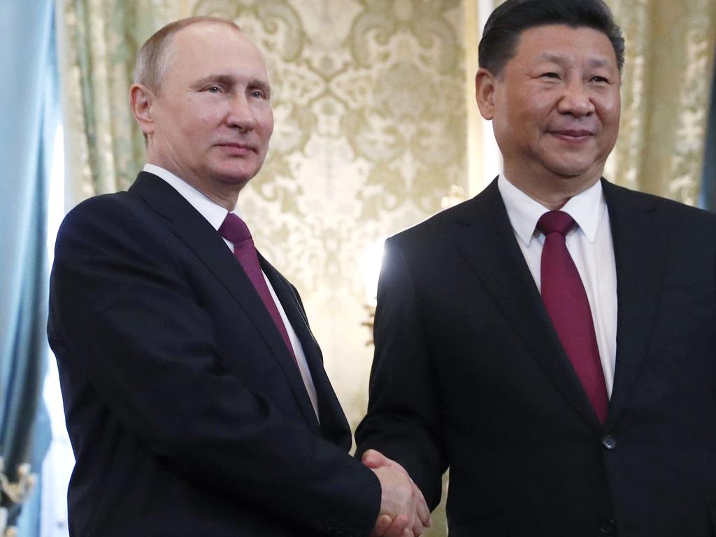 Chinese President Xi Jinping (R) andRussian President Vladimir Putin are growing closer, the US warns. Picture: AFP