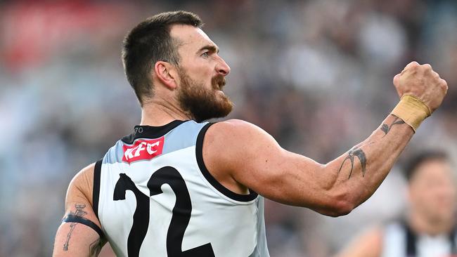 Charlie Dixon of the Power celebrates kicking a goal against Collingwood.