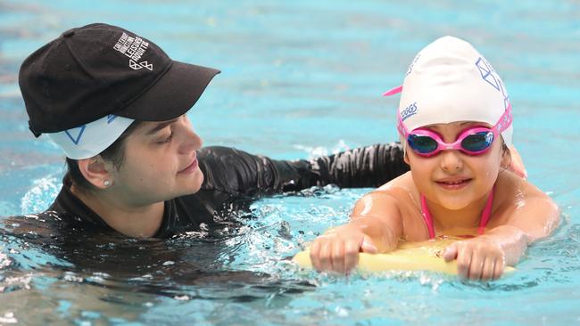 Samara Sbeit (5) being taught to swim by instructor Elleni Andeopoulos at the Roselands Leisure and Aquatic Centre.