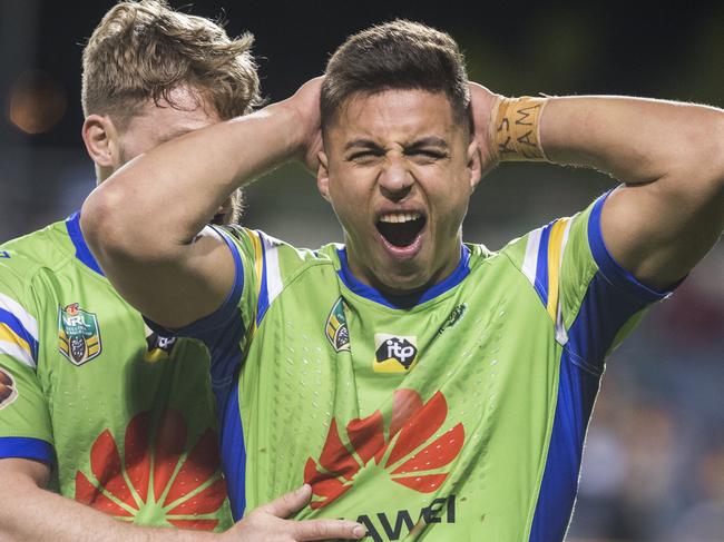 Joe Tapine of the Raiders grimaces after scoring a try.