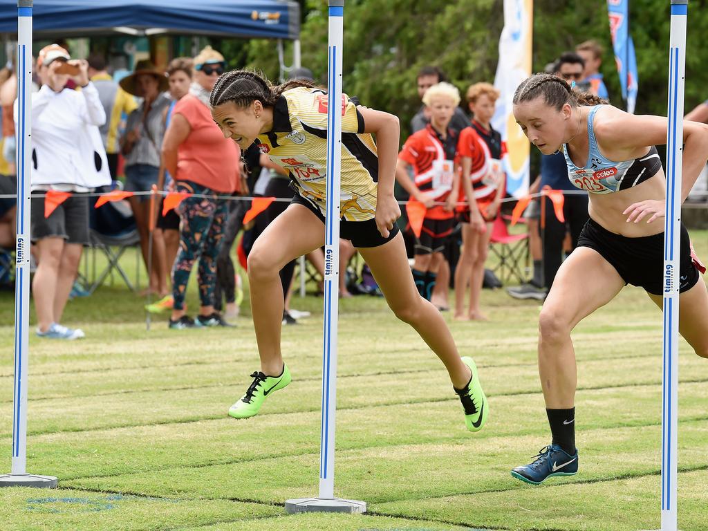 South Coast Little Athletics Titles at Pizzey Park in Miami. Girls 100 metre 14 yrs. Amali Butcher (on right) just beats Dior Scholz over the line. Picture: Lawrence Pinder