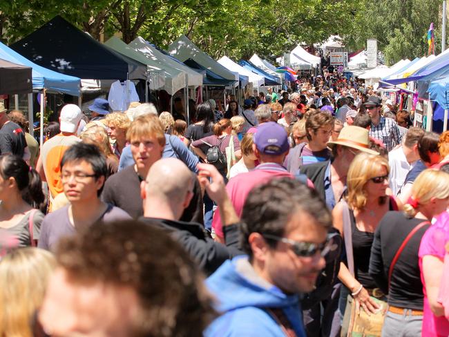 Christmas shopping at Salamanca Market in Hobart, large crowd of people searching for bargains at the market