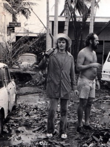 Cyclone Tracy caused major destruction to Darwin. Photographers Beat Erismann (left) and Barry ‘Baz’ Ledwidge, pictured outside their home in Darwin on Christmas morning in 1974, just hours after cyclone Tracy struck. Picture supplied by Beat Erismann.