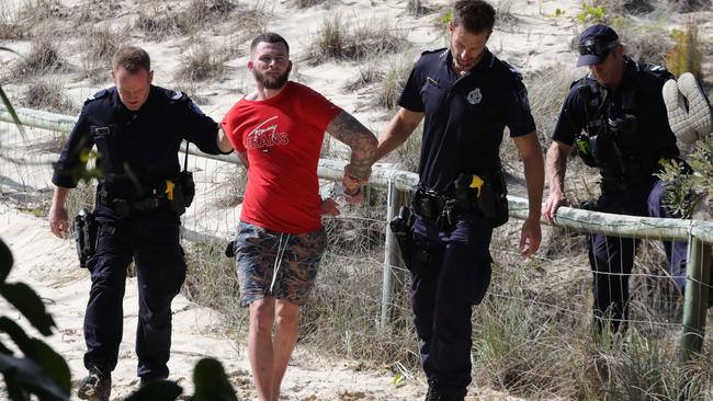 Police chased and arrested an alleged runner from Gold Coast Airport at Coolangatta. Picture: Glenn Hampson.