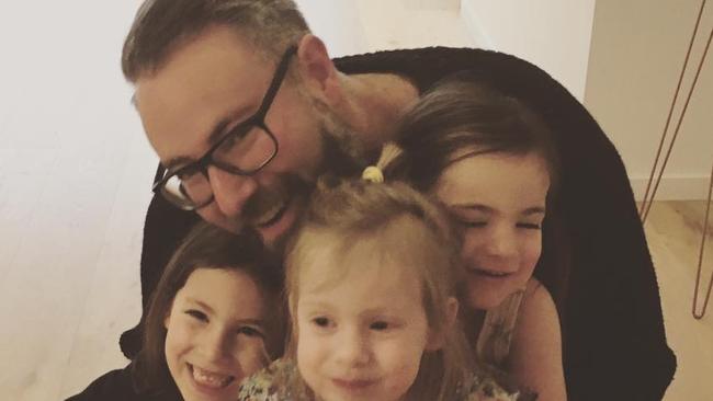 Darren Levin and his three daughters.