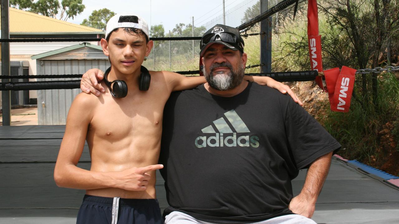 Arrernte community boxing gym founder Jason Lord with rising star Arnold Baird. Picture: Josh Hanrahan